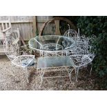 A WHITE PAINTED WROUGHT METAL CIRCULAR GARDEN TABLE with a glass top, 112cm diameter x 75cm high
