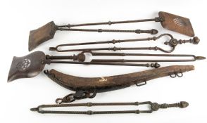 A GROUP OF SIX 19TH CENTURY FIRE IRONS to include four steel examples and two brass, one shovel 74cm