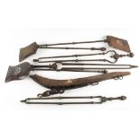 A GROUP OF SIX 19TH CENTURY FIRE IRONS to include four steel examples and two brass, one shovel 74cm