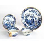 AN EARLY 19TH CENTURY WEDGWOOD PORCELAIN TEA CUP, SAUCER AND PLATE with blue, white and gilded