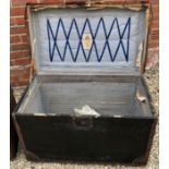 AN ANTIQUE IRON AND LEATHER BOUND TRUNK