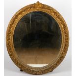 A LARGE LATE 19TH CENTURY GILDED GESSO OVAL WALL MIRROR 103cm wide x 125cm high Condition: some