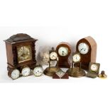 AN ANTIQUE GERMAN WALNUT CASED MANTLE CLOCK by RSM, the brass and silvered dial with roman numerals,