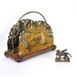 Brass newspaper or letter rack and a bronzed metal model of a gryphon (2)