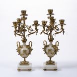 Pair of classical style onyx and gilt brass candlesticks with square base standing on four feet,