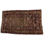 Persian rug with geometric stylised central panel and foliate border, 158cm x 89cm