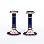 Pair of cobalt blue porcelain candlesticks English, 19th Century, each with painted flower sprays in