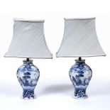 Pair of Delft vases, later converted into lamps of waisted form, each with a decorative panel,