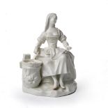 Vienna porcelain white figure of a cook 18th Century, circa 1770, seated by a saucepan on a