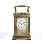 French repeater carriage clock with striking movement, enamel dial and Roman numerals, in a fluted
