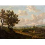 19th Century English School An extensive pastoral landscape view with two figures resting on a path,