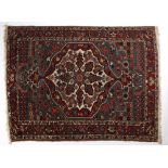 Hamadan blue ground rug with central foliate shaped medallion, and red ground foliate border 194cm x