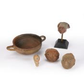 Group of antiquities Roman and Egyptian including a mounted pottery head, 12cm high (inc stand), a