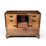 Campaign style chest of drawers late19th/early 20th Century, oak with brass banding, the central