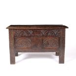 Small oak coffer 18th Century, with carved front, 93cm across, 41cm deep, 58cm high