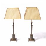 Pair of brass table lamps of column form with square bases, and matching parchment type shades, 67cm