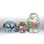Group of three vases Chinese, to include a lidded Canton vase decorated with flowers to one side and
