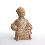 Pottery figure of an immortal Chinese, Han Dynasty, in a seated position with robes around his waist