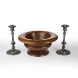 Pair of silver plated candlesticks and a treen turned mortar or pedestal bowl, 35cm wide x 16cm high