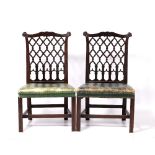 Pair of Chinese Chippendale style chairs circa 1900, each with lattice back and green