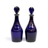 Pair of Bristol blue glass decanters early 19th Century, marked ''Brandy'' and ''Hollands'' each