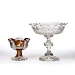 Two cut glass tazzas of pedestal bowls the largest a possibly Irish cut glass example 22cm high, the