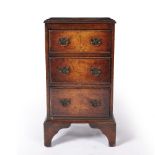 Three drawer walnut chest standing on bracket feet, 1930's reproduction, 71cm high x 40cm wide