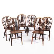 Near set of six 'Oxford' elm and ash wheel-back chairs with stretcher supports, one stamped to the