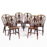 Near set of six 'Oxford' elm and ash wheel-back chairs with stretcher supports, one stamped to the