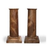 Pair of Giallo Antico marble columns Italian, each having a cylindrical column and square bases,