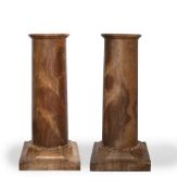 Pair of Giallo Antico marble columns Italian, each having a cylindrical column and square bases,
