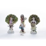 Pair of English porcelain figures 'Flower Sellers' unmarked, 17cm high and a Meissen porcelain model