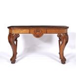 Walnut hall table 19th Century, with carved shield to the frieze on scroll supports, with later top,
