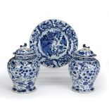 Pair of lidded blue and white vases Chinese, 19th Century, decorated to the exterior with birds in