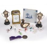 Brass cased carriage clock French, with Roman numerals, two silver plated trophies on stands,