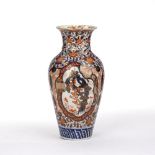 Imari vase Japanese, of baluster form, decorated to the body with flowering trees and rock work,