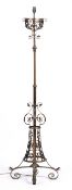 In the manner of W A S Benson (1854-1924) Adjustable lamp standard, wrought metal on quadripartite