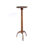 Arts and Crafts style oak jardiniere stand on a tripod base, 107cm high