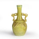 After Christopher Dresser (1834-1904) Reticulated pottery vase with yellow and green decoration,