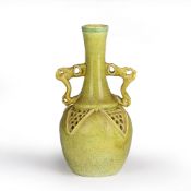 After Christopher Dresser (1834-1904) Reticulated pottery vase with yellow and green decoration,