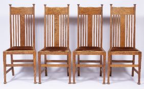 Attributed to Liberty & Co Set of four Arts and crafts oak dining chairs, unmarked, 105.5cm high (4)