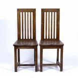 In the manner of Liberty & Co Pair of oak high back chairs, 95cm high (2)