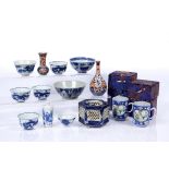 Group of Chinese and Japanese pieces including four Chinese blue and white wine cups, each with