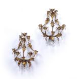 Pair of gilt metal and glass wall sconces of leaf form with various lozenge drops, 34cm high, 29cm