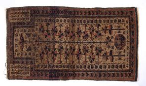 Beluch rust ground rug with stylised medallions, 150cm x 82cm Condition: Some fraying to the edges