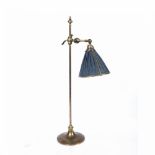 Brass student's lamp 1930's, with adjustable shade, 63cm high Condition: discolouration and silk