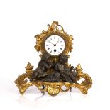 Mantel clock late 19th Century, with gilt painted scrolling acanthus decoration, the white enamel