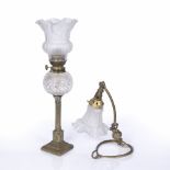 Art Nouveau desk lamp brass base with shaped glass shade, 28cm high and an oil lamp on brass