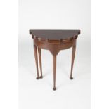 Mahogany shaped tea table Edwardian, on tapering supports with fold over top, 61cm wide, 30cm