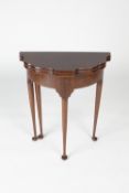 Mahogany shaped tea table Edwardian, on tapering supports with fold over top, 61cm wide, 30cm
